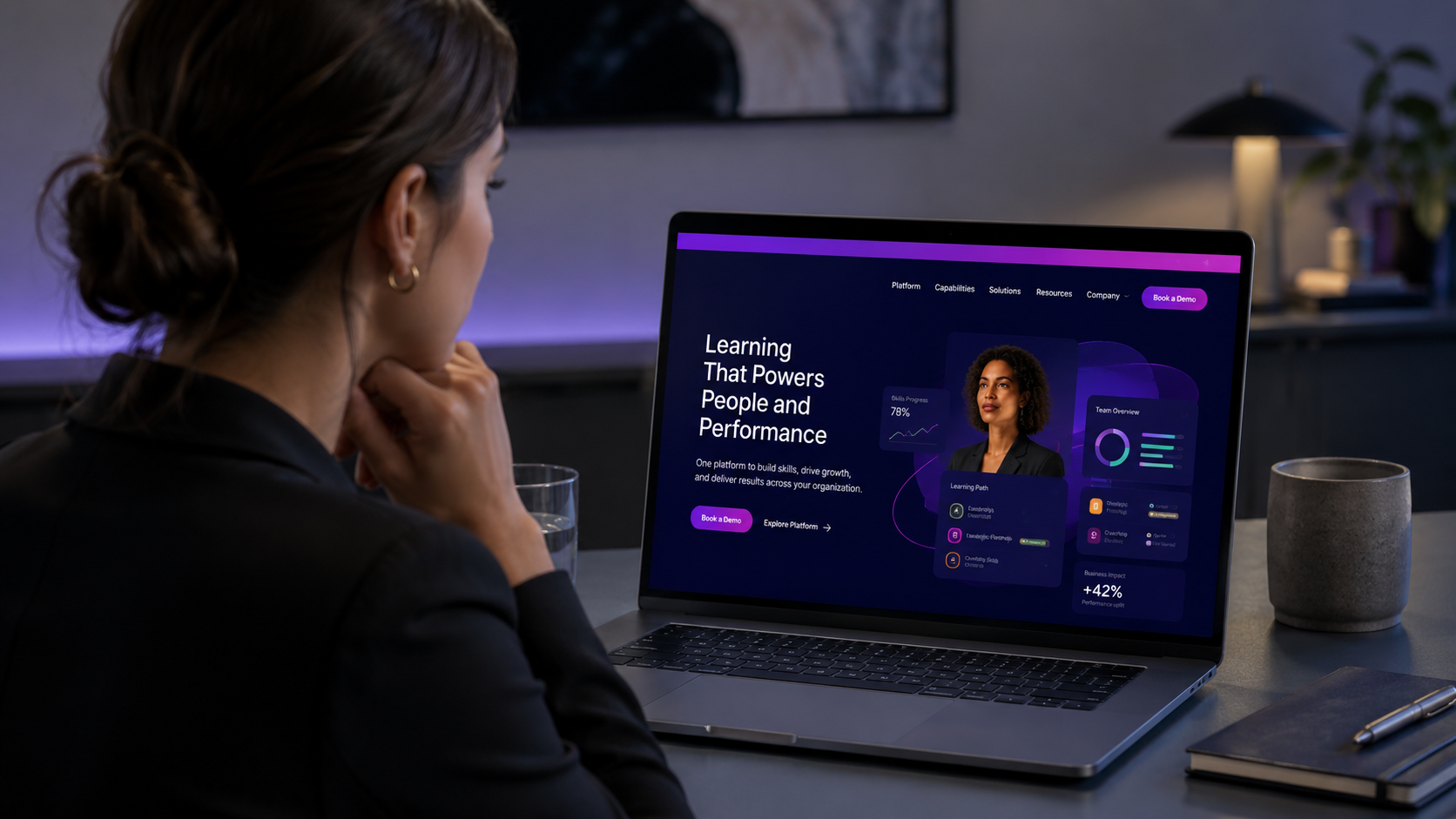 Digital Learning Platform Localization Woman viewing an anonymized digital learning platform interface on a MacBook Pro